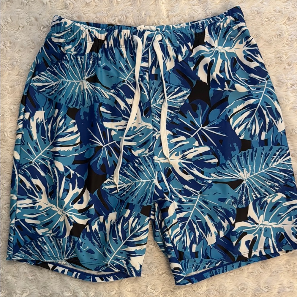 Men’s Blue and White Board Shorts with Tropical Design